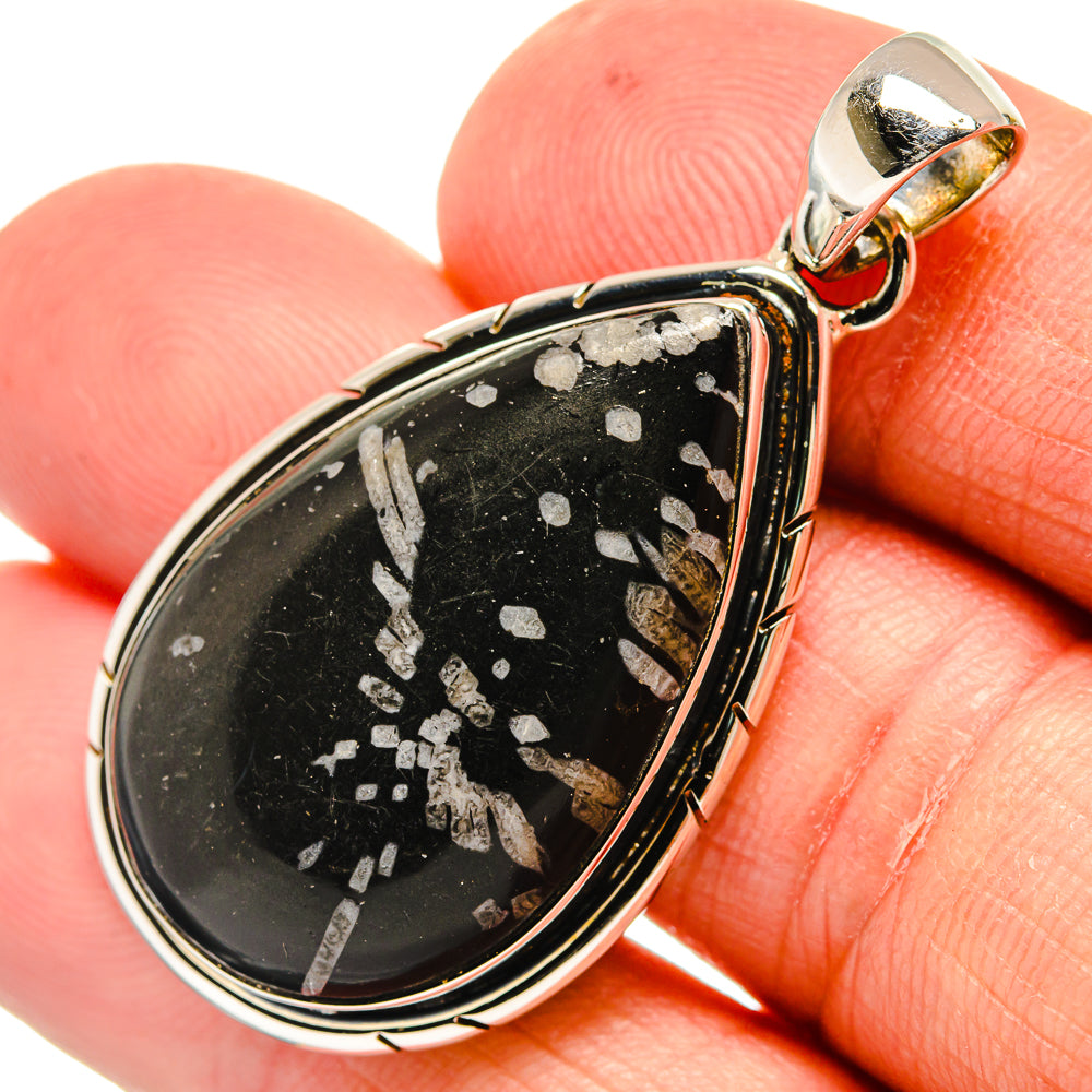 Sterling silver teardrop pendant with black stone and light speckles, round bail