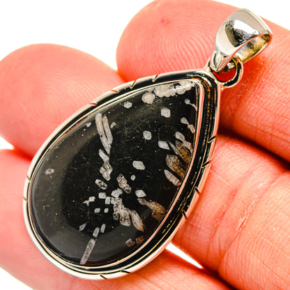 Sterling silver teardrop pendant with black stone and light speckles, round bail