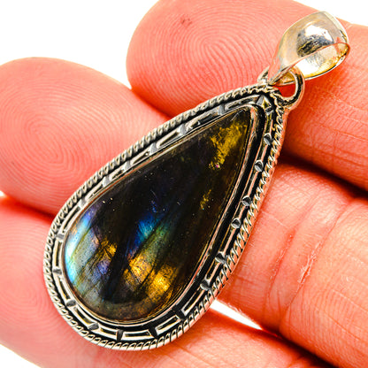 Labradorite teardrop pendant with ornate 925 sterling silver setting and hinged bail