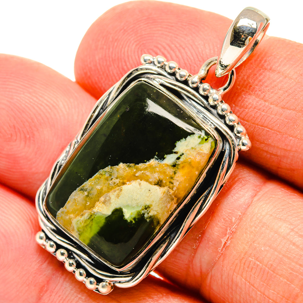 Green opal pendant with silver frame and bead chain border, on bail clip.