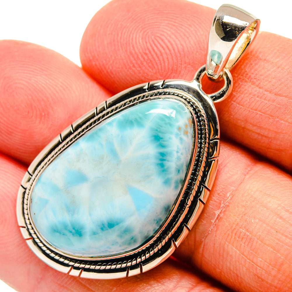 Close-up oval larimar pendant with engraved 925 sterling silver frame and bail