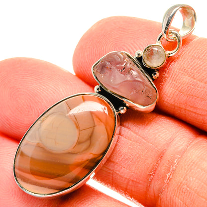 Oval stone pendant in sterling silver with pink and amber cabochons and bail ring