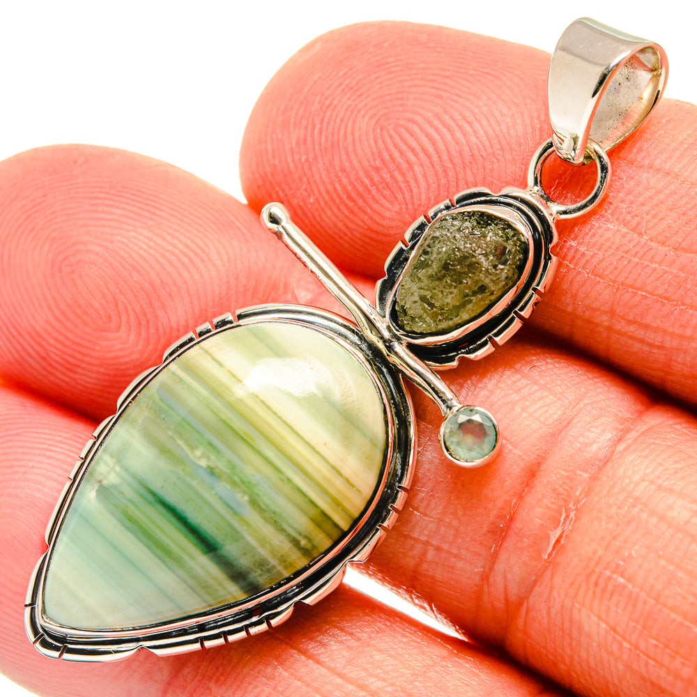 Oval green striped jasper pendant with small round green gem and bail in sterling silver