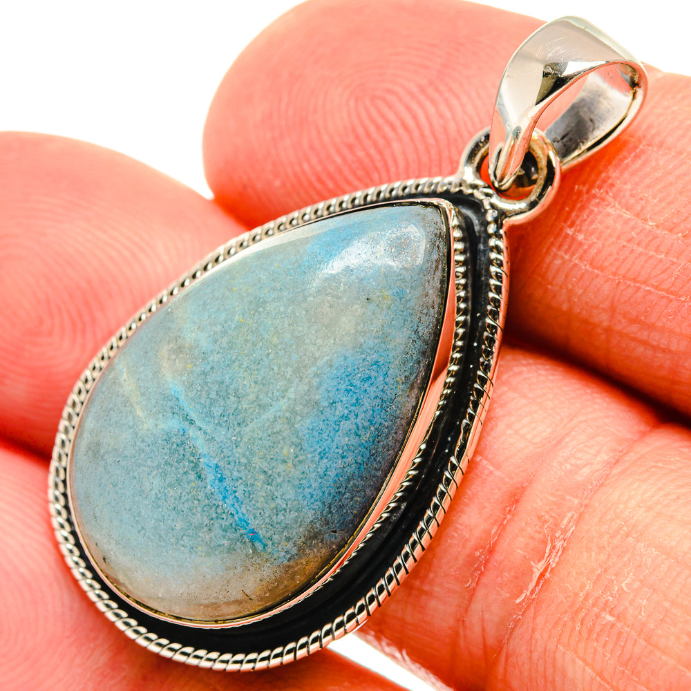 Larimar blue teardrop pendant in 925 sterling silver with textured bezel and bail