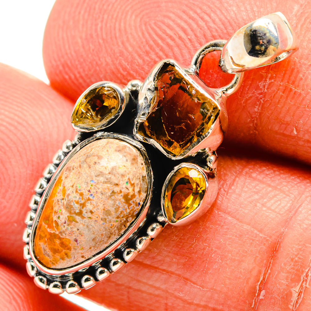 Oval orange fire opal pendant in sterling silver with yellow citrine side stones