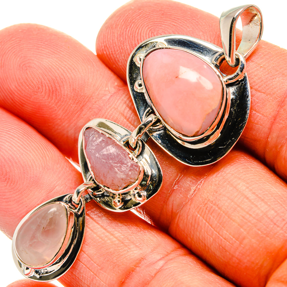 925 sterling silver pendant with three pink oval opal cabochons in black settings