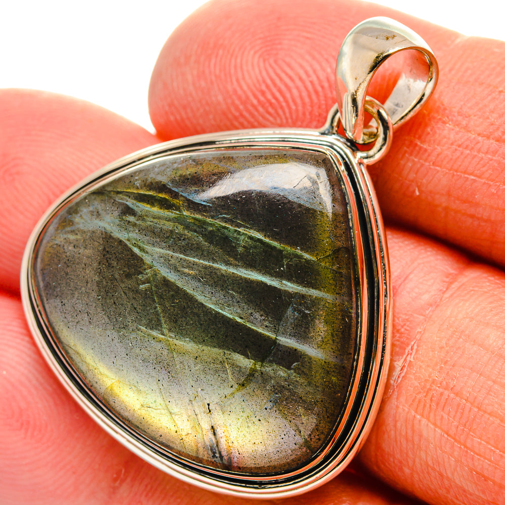 Labradorite teardrop pendant with silver bezel and bail, black-green-yellow flash