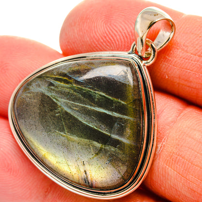Labradorite teardrop pendant with silver bezel and bail, black-green-yellow flash