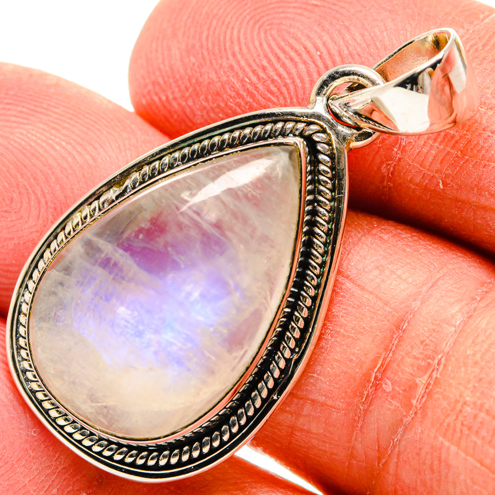 Teardrop moonstone pendant in ornate 925 sterling silver setting with clasp bail