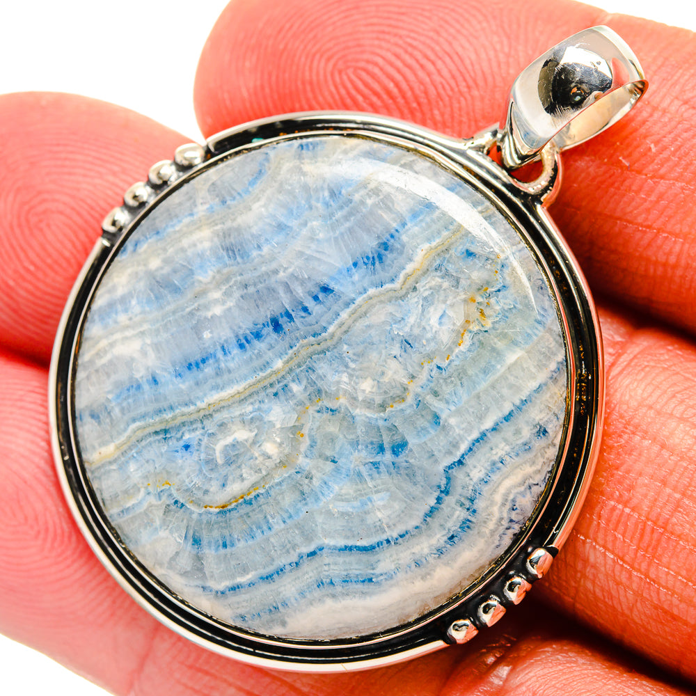 Blue scheelite pendant, 925 sterling silver round setting with bead rim