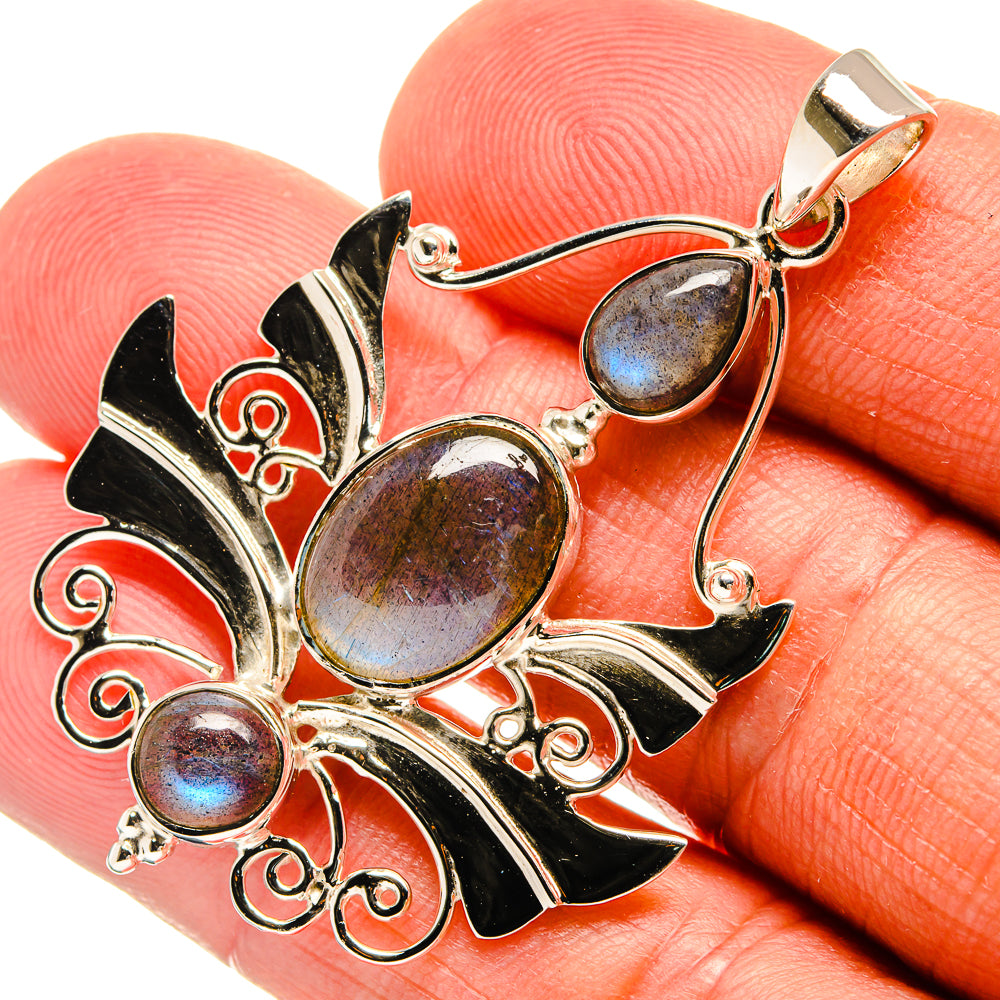 Labradorite pendant in 925 sterling silver with oval blue-sheen stones and black enamel leaves