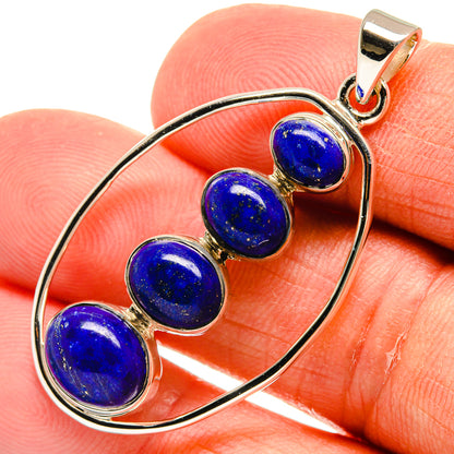 Lapis lazuli bead pendant with oval sterling silver frame and bail, close-up