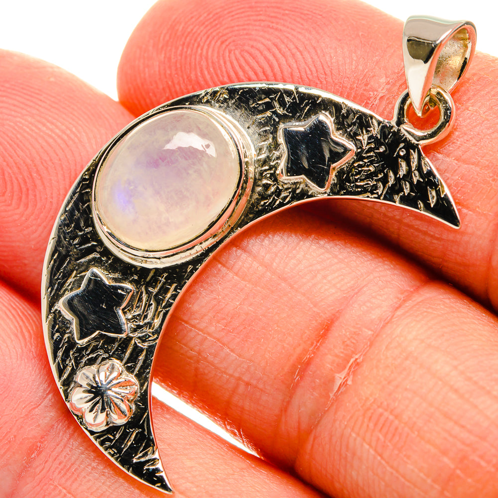Crescent moon pendant in sterling silver with oval moonstone and star accents