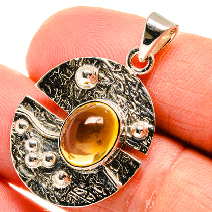 Amber citrine round pendant close-up with textured 925 sterling silver setting