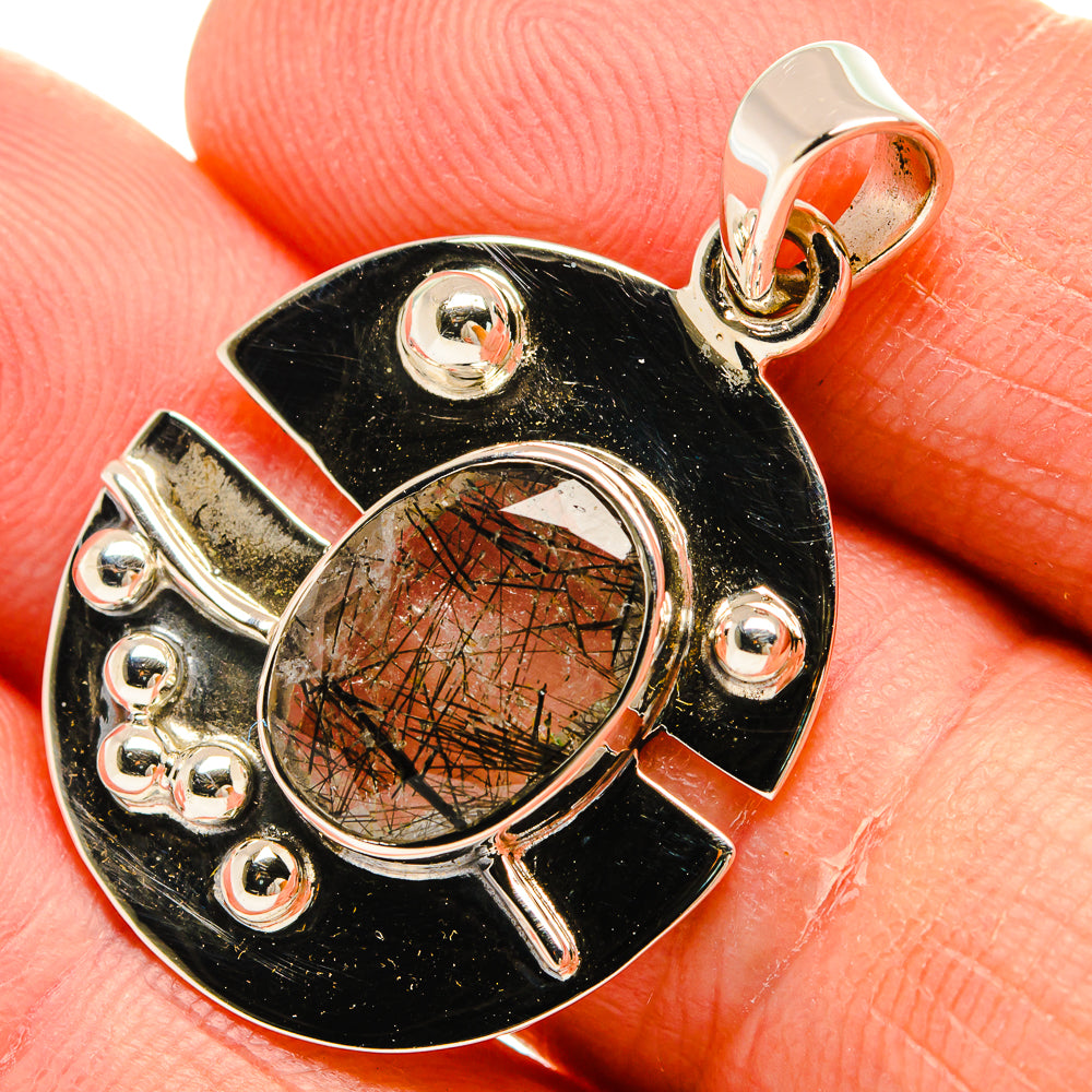 Tourmalinated quartz pendant with dark scalloped settings and 925 sterling silver bail