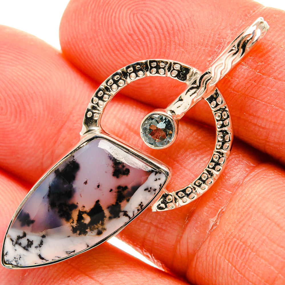 Sterling silver pendant with dendritic opal teardrop, blue topaz round stone and hoop bail