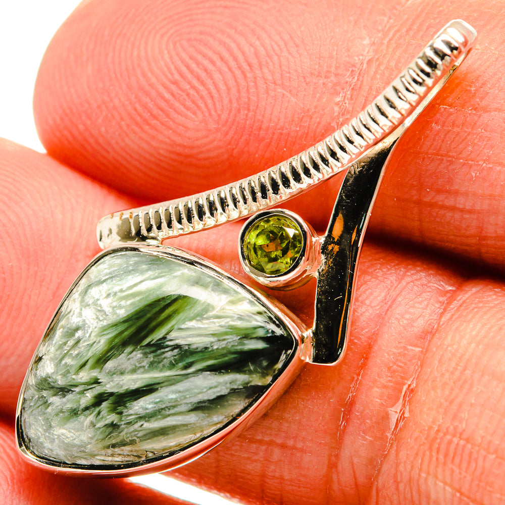 Sterling silver pendant with oval green gemstone and round peridot accent, teardrop bail