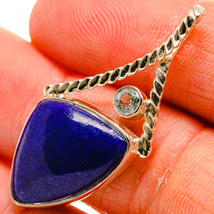Teardrop lapis lazuli pendant with round blue topaz and ornate 925 sterling silver frame