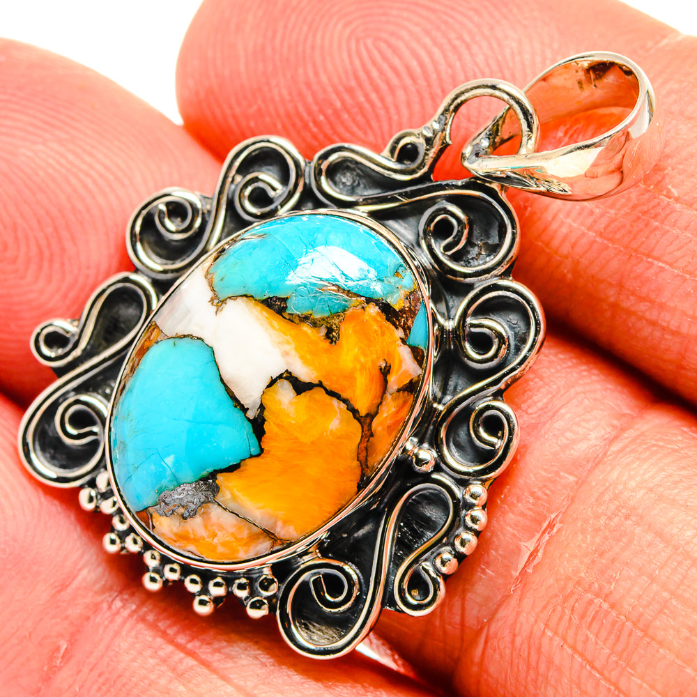Spiny oyster turquoise pendant in ornate 925 sterling silver oval setting, close-up view