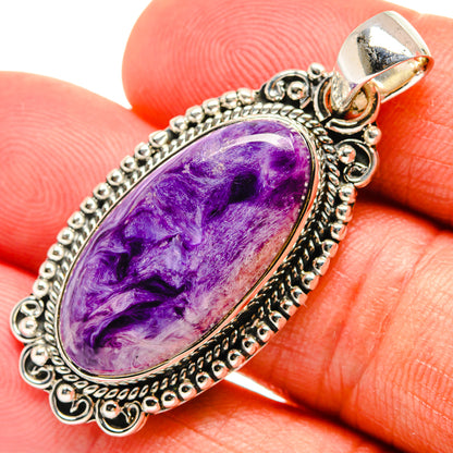 Purple charoite oval pendant with decorative 925 sterling silver setting, close-up