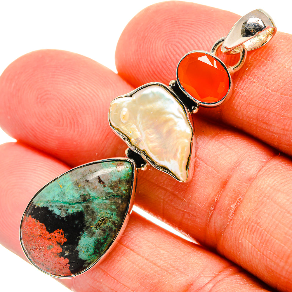 Sterling silver pendant with orange carnelian, iridescent mother-of-pearl, and green stone