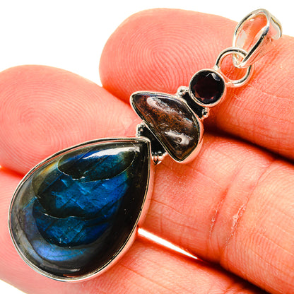 Sterling silver labradorite teardrop pendant close-up with dark round stone top links