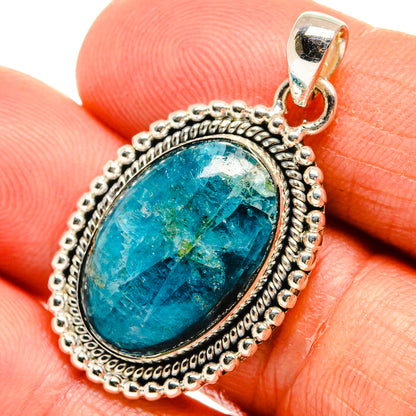 Oval turquoise apatite pendant in ornate sterling silver bezel with bail, close-up