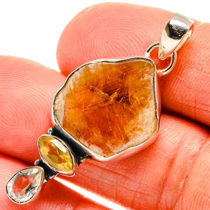 925 sterling silver pendant close-up with rough orange citrine and small quartz stones