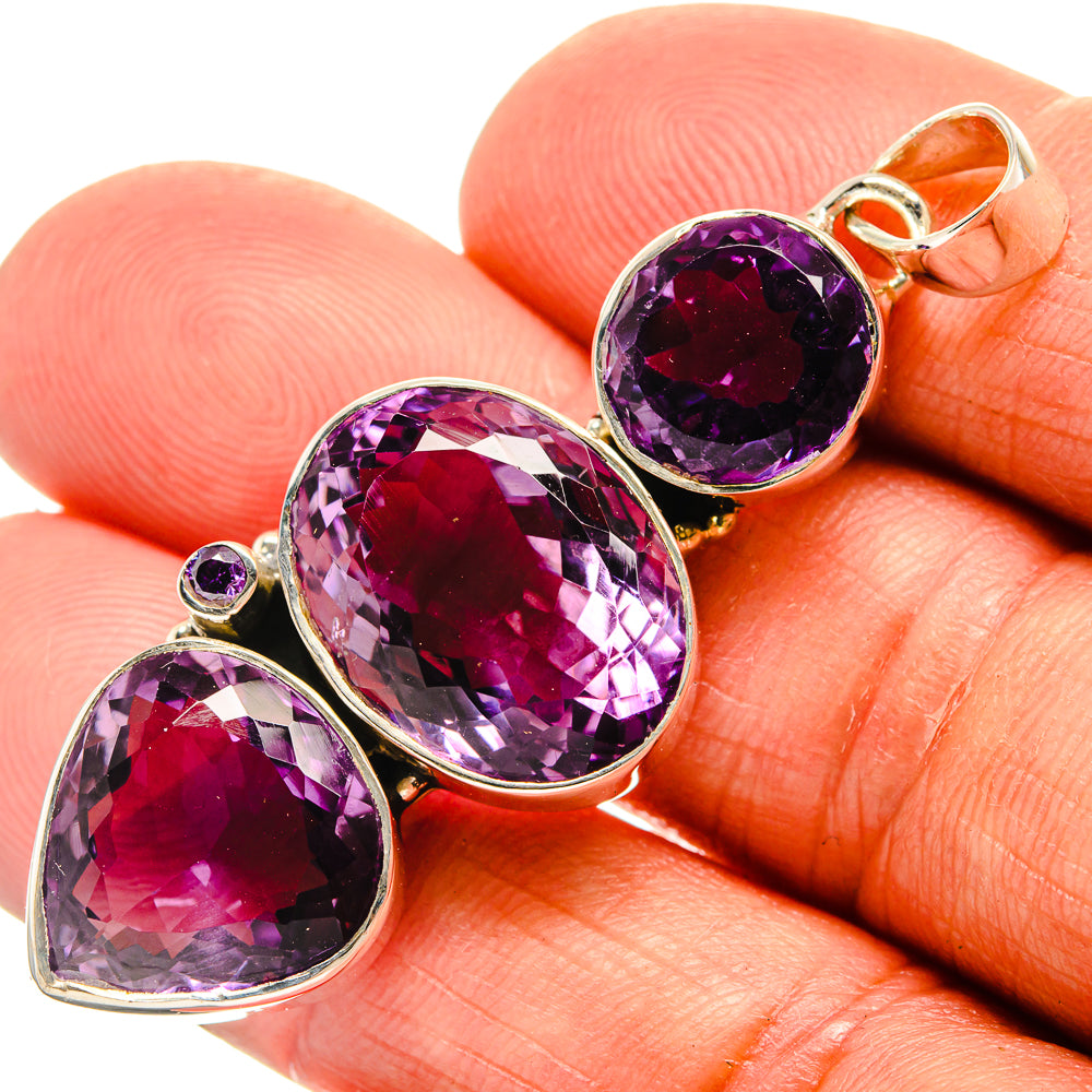 Faceted amethyst pendant in silver with round and pear-shaped purple stones