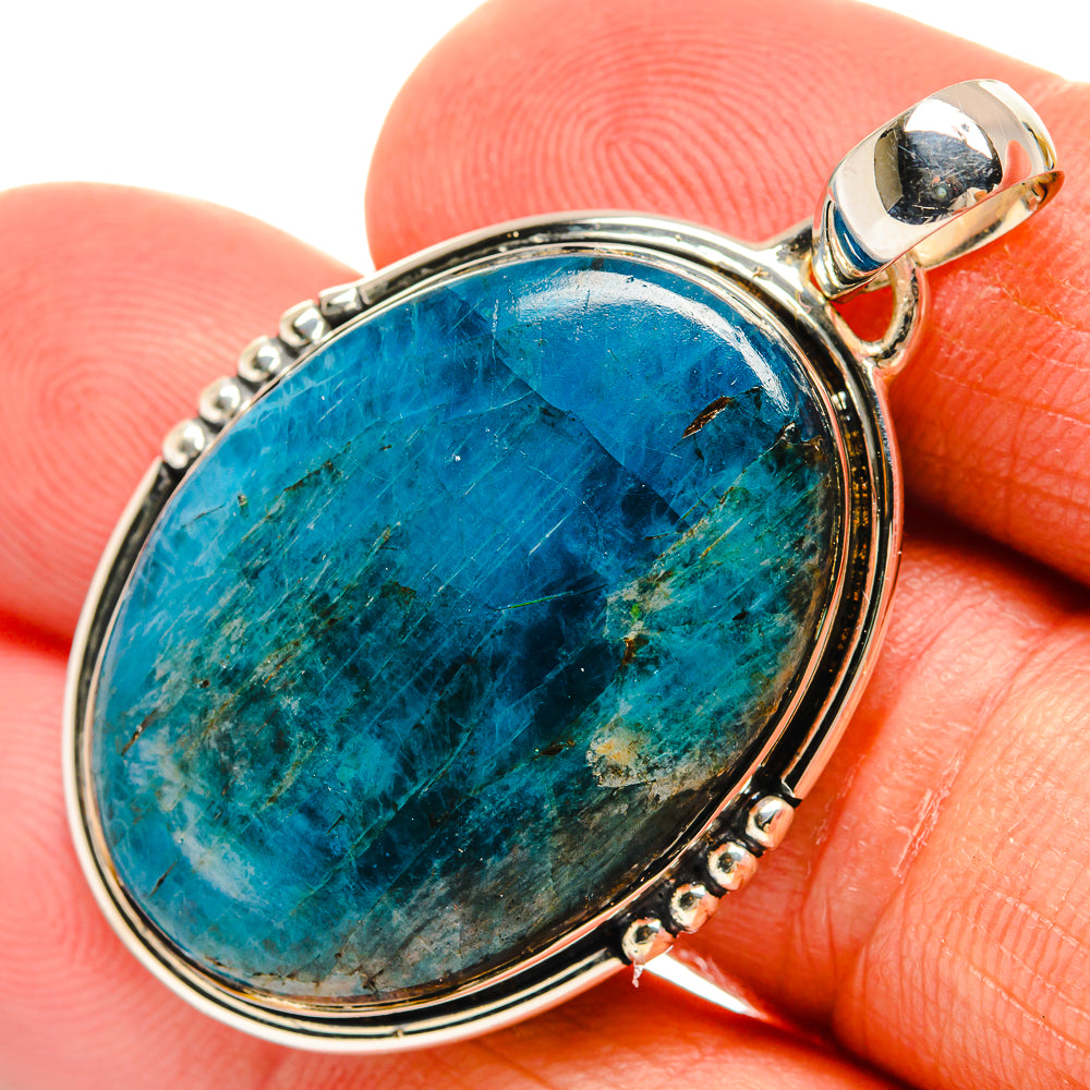 Oval apatite pendant with blue-green stone set in sterling silver prongs