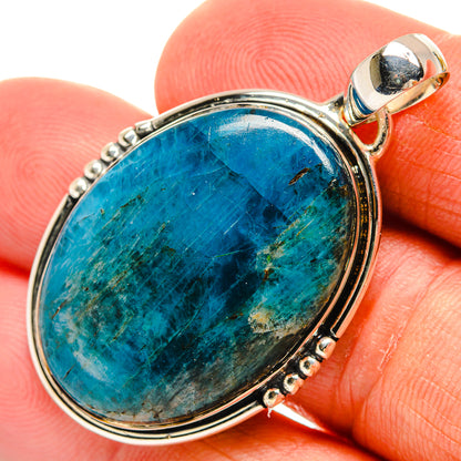 Oval apatite pendant with blue-green stone set in sterling silver prongs