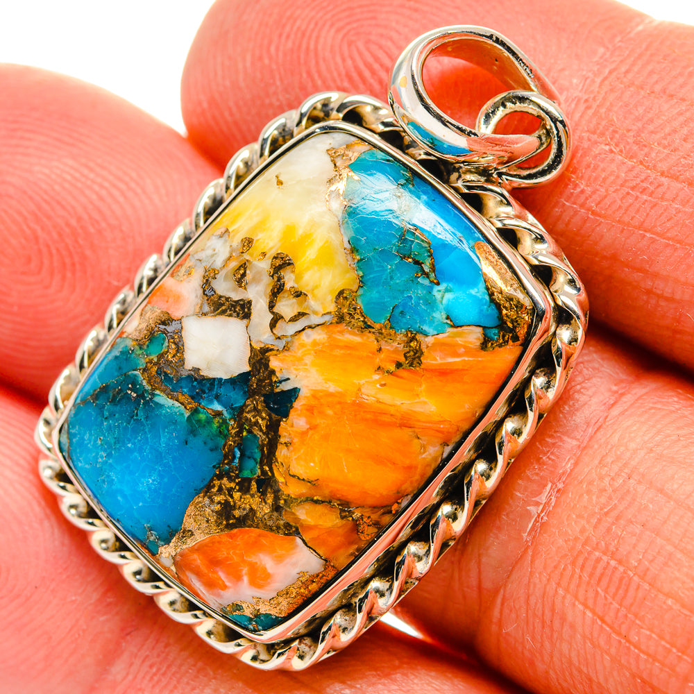 Close-up turquoise/orange marbled stone pendant with 925 sterling silver frame