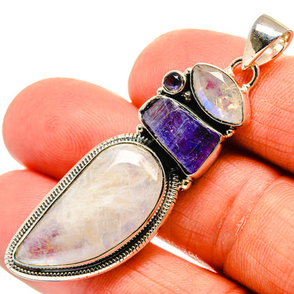 Oval rainbow moonstone pendant with purple tanzanite and round stone, silver bail top