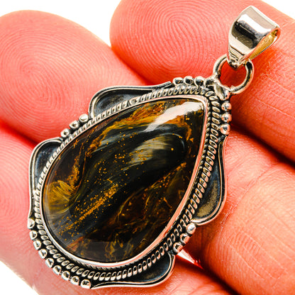 Sterling silver pietersite teardrop pendant with gold-brown and dark marbled cabochon, top bail