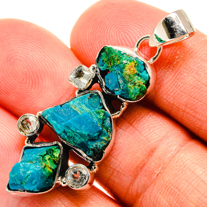 Close-up rough gemstone pendant in 925 silver with blue-green stones and small round accents