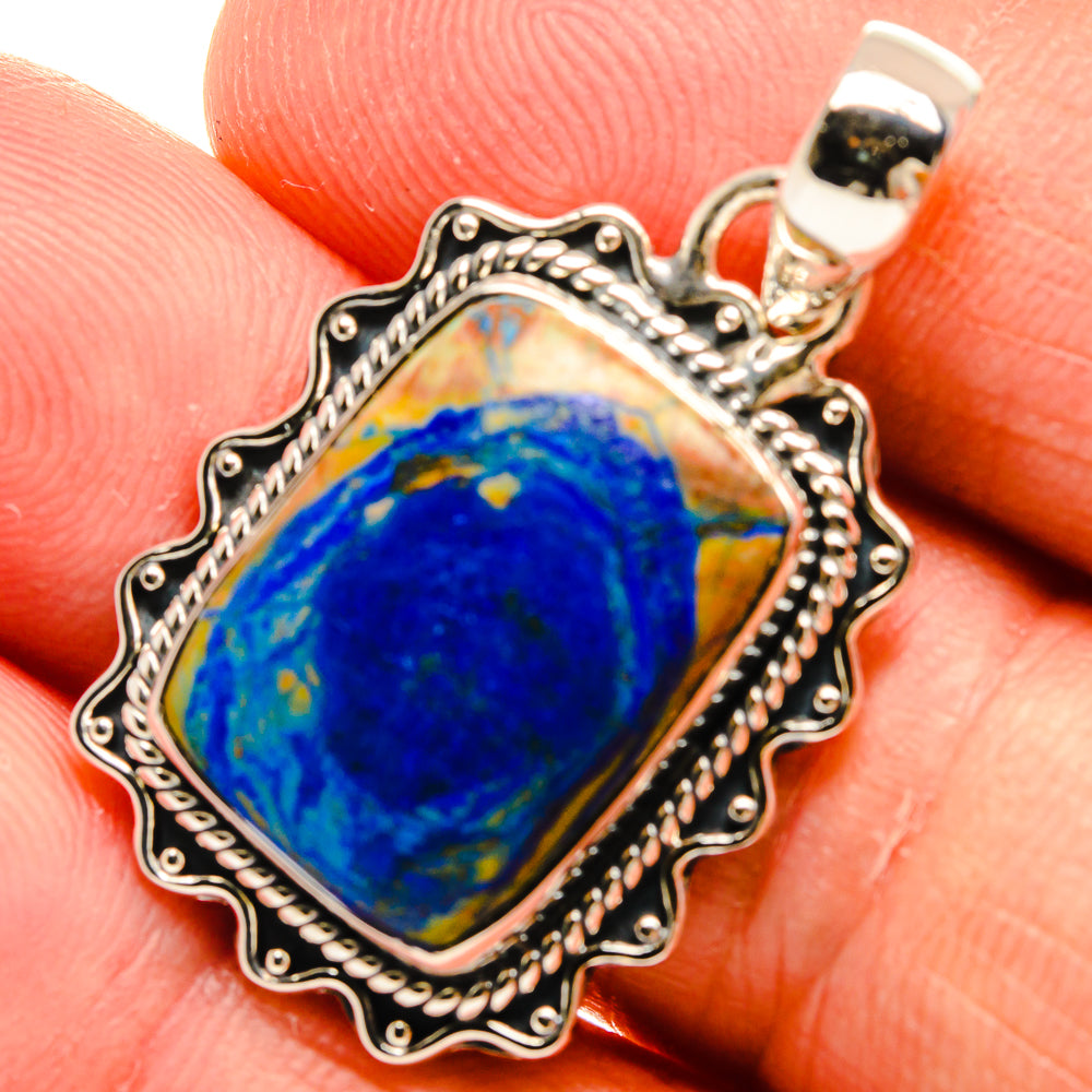 Sterling silver azurite gemstone pendant close-up, blue stone in scalloped bezel.