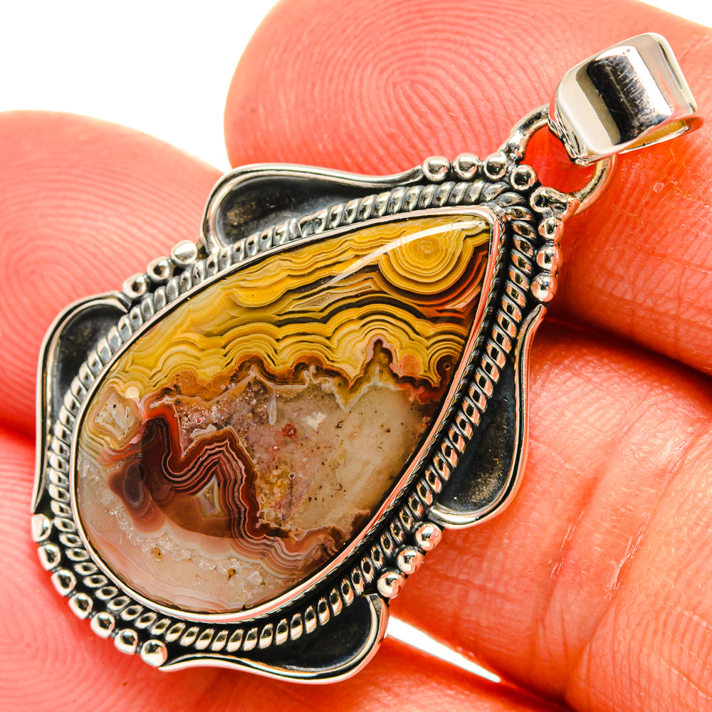 Teardrop lace agate pendant in 925 sterling silver with ornate bezel and bail