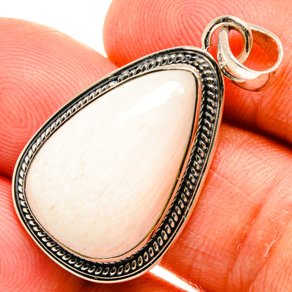 Teardrop white stone pendant close-up, 925 sterling silver bail and textured edge