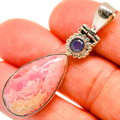Sterling silver pendant closeup: pink teardrop stone with blue round gemstone top