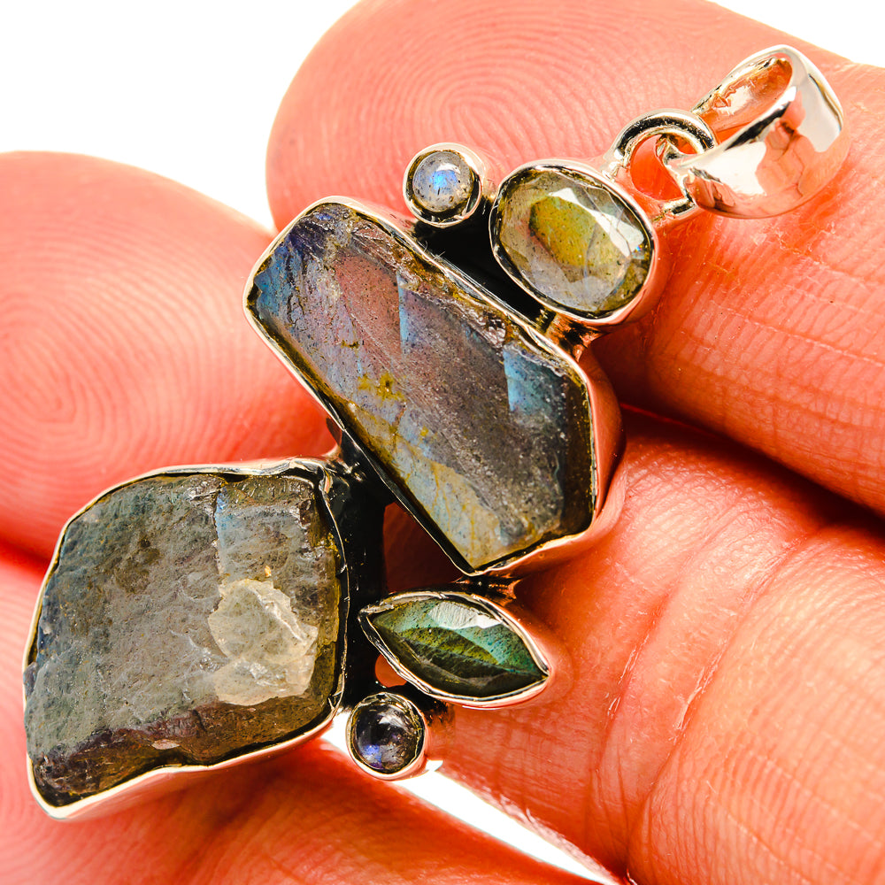 Rough labradorite pendant in 925 sterling silver with blue and green stones accents