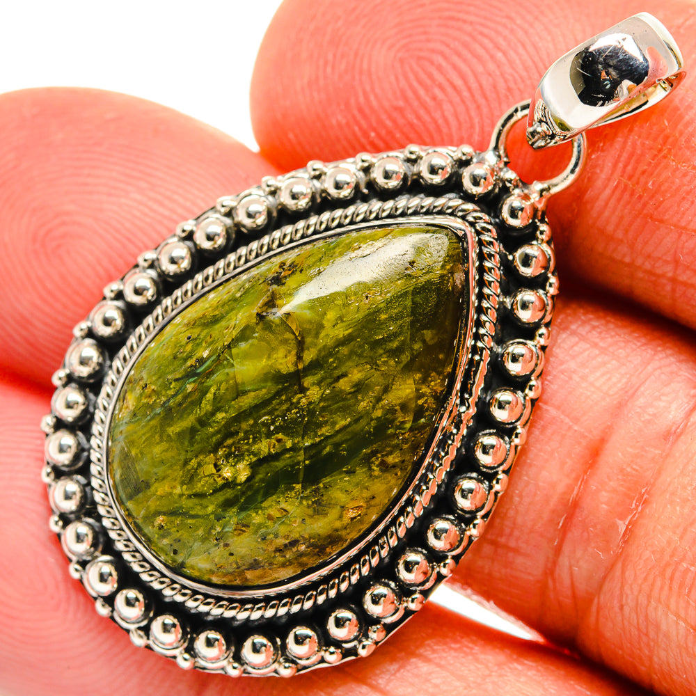 Sterling silver jasper pendant close-up: green/yellow marbled stone in beaded frame