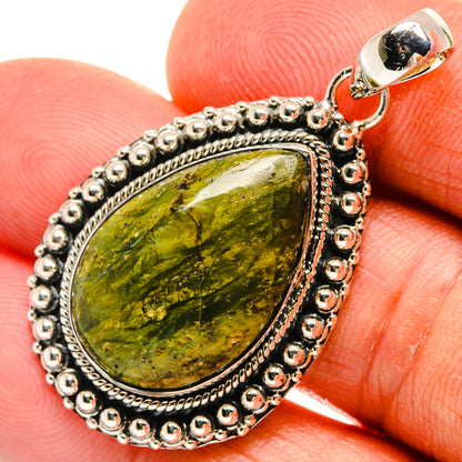Sterling silver jasper pendant close-up: green/yellow marbled stone in beaded frame