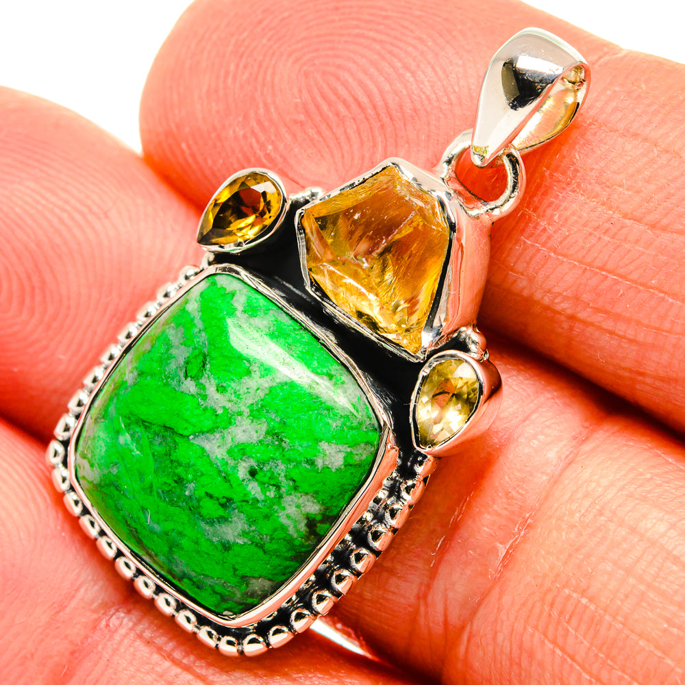 Sterling silver pendant close-up with green maw sit sit stone and orange-yellow citrine