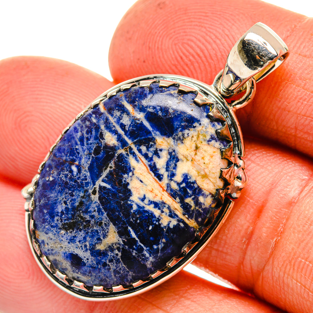 Sodalite oval pendant in sterling silver bezel with bail and textured blue stone