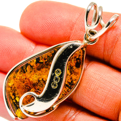 Baltic amber teardrop pendant in 925 sterling silver with black and amber resin inlay