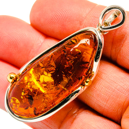 Amber teardrop pendant in 925 sterling silver, close-up with loop bail