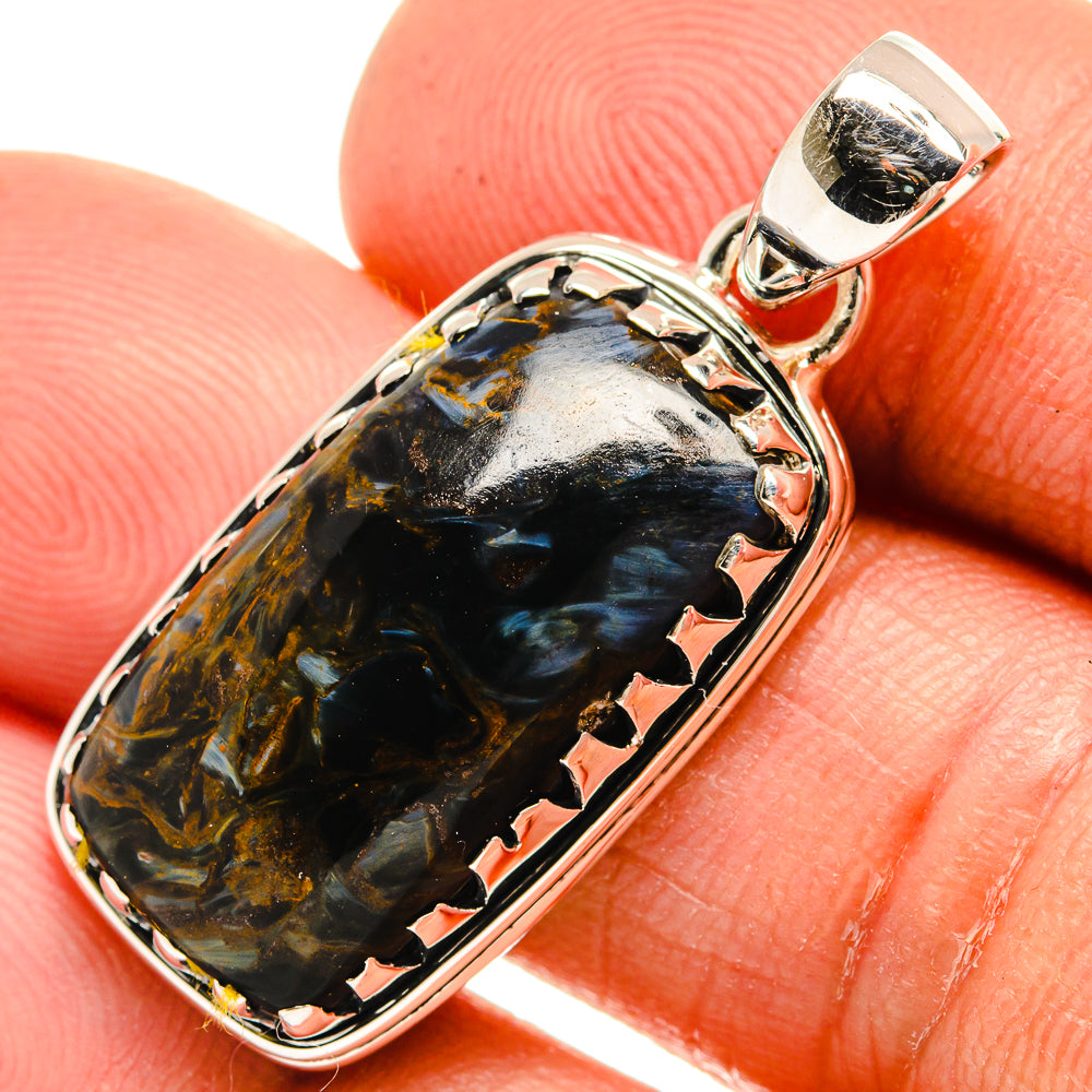 Close-up oval pietersite pendant with 925 sterling silver bail and prong-set bezel
