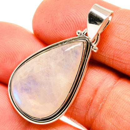 Close-up teardrop moonstone pendant showing pearly iridescence in silver bezel