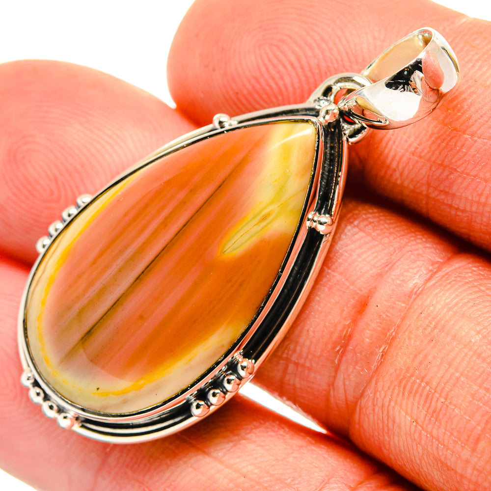 Sterling silver teardrop jasper pendant with orange-gold cabochon and ornate frame