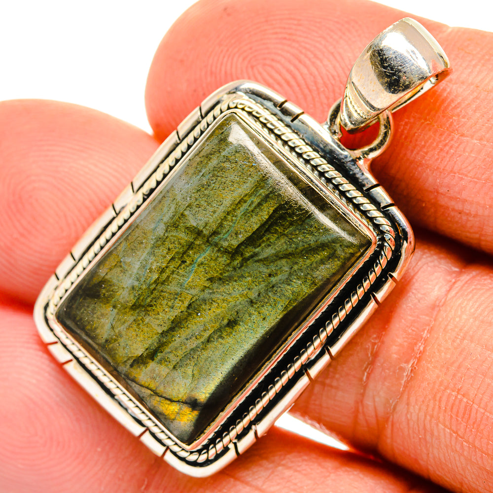 Rectangular labradorite pendant in silver with green-gold flash, ornate rope border